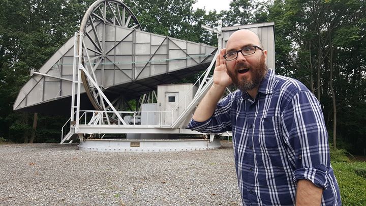 A picture of Matt Johnson standing in front of the horn